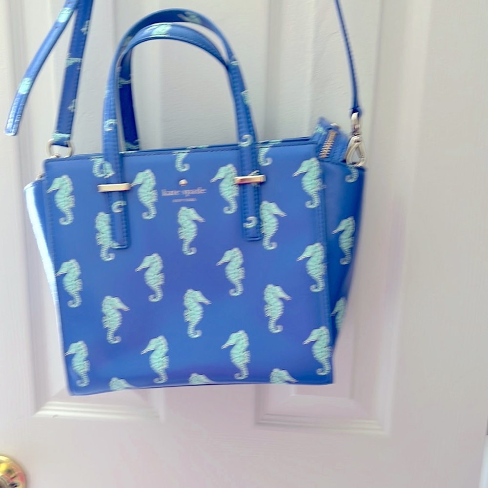 Kate spade handbag with adjustable removable strap. Blue leather with seahorses.